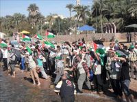 Members of lifeline convoy head to Latakia port to pressure Egyptians