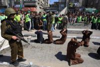 IOF troops suppress march in Beit Ummar, injure journalists and citizens